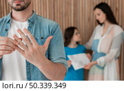 adult male taking wedding ring off. Стоковое фото, агентство Ingram Publishing / Фотобанк Лори