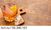 high angle whiskey orange with copy space. Стоковое фото, агентство Ingram Publishing / Фотобанк Лори