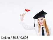 smiling young graduating woman with diploma. Стоковое фото, агентство Ingram Publishing / Фотобанк Лори