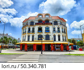 Phu Quoc, Vietnam - April 06, 2025: Stunning view of Crazy Crab restaurant in VinPearl District at Vin Wonders Park, Phu Quoc Island, Vietnam on a sunny day. Редакционное фото, фотограф Кривошеина Елена Леонидовна / Фотобанк Лори