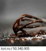 whisk filled with melted chocolate close up. Стоковое фото, агентство Ingram Publishing / Фотобанк Лори