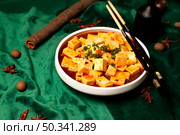 Authentic Ma Po Tofu Served in a White Bowl at a Chinese Restaurant. Стоковое фото, фотограф Aleksandr Golubev / Фотобанк Лори