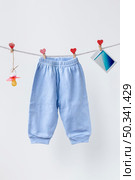 front view cute little baby pants accesories. Стоковое фото, агентство Ingram Publishing / Фотобанк Лори