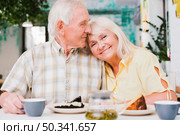 loving elderly couple drinking tea with cake. Стоковое фото, агентство Ingram Publishing / Фотобанк Лори
