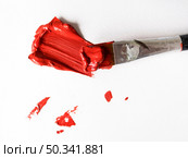 OLYMPUS DIGITAL CAMERA. brush with red paint canvas. Стоковое фото, агентство Ingram Publishing / Фотобанк Лори