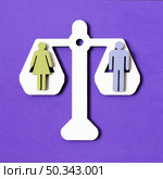 equality man woman pair scales. Стоковое фото, агентство Ingram Publishing / Фотобанк Лори