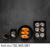 flat lay plates with maki nigiri sushi with copy space. Стоковое фото, агентство Ingram Publishing / Фотобанк Лори