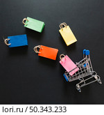 toy supermarket cart with colourful packets. Стоковое фото, агентство Ingram Publishing / Фотобанк Лори