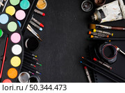flat lay various brushes crayons copy space. Стоковое фото, агентство Ingram Publishing / Фотобанк Лори
