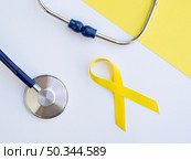 OLYMPUS DIGITAL CAMERA. high angle arrangement with children cancer ribbon. Стоковое фото, агентство Ingram Publishing / Фотобанк Лори