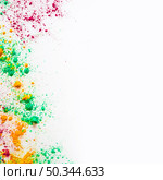 holi color powder with copy space writing text white backdrop. Стоковое фото, агентство Ingram Publishing / Фотобанк Лори