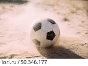 soccer ball sand particles. Стоковое фото, агентство Ingram Publishing / Фотобанк Лори
