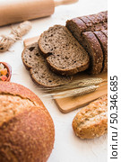 wheat spikelets near bread. Стоковое фото, агентство Ingram Publishing / Фотобанк Лори