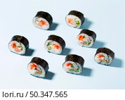 delicious sushi rolls aligned table. Стоковое фото, агентство Ingram Publishing / Фотобанк Лори
