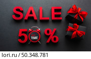 sale fifty percent discount with clock. Стоковое фото, агентство Ingram Publishing / Фотобанк Лори