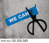 top view we cant message card being cut with scissor. Стоковое фото, агентство Ingram Publishing / Фотобанк Лори