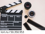 clapperboard camera lenses film reels. Стоковое фото, агентство Ingram Publishing / Фотобанк Лори