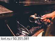 crop hand throwing out coffee. Стоковое фото, агентство Ingram Publishing / Фотобанк Лори