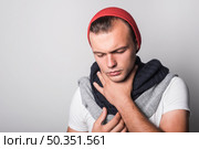 man with closed eyes suffering from cough. Стоковое фото, агентство Ingram Publishing / Фотобанк Лори
