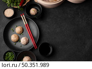 top view asian dumplings with chopsticks copy space. Стоковое фото, агентство Ingram Publishing / Фотобанк Лори