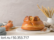 Fogaca on kitchen countertop with eggs and cinammon sticks. Traditional cake from Santa Maria da Feira, Portugal. Стоковое фото, агентство Ingram Publishing / Фотобанк Лори