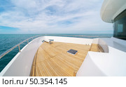 Yacht panorama on deck. Calm sea water at day. Modern and luxury transportation. Стоковое фото, агентство Ingram Publishing / Фотобанк Лори