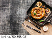 tasty snail sausage garnish with red peppercorn basil. Стоковое фото, агентство Ingram Publishing / Фотобанк Лори