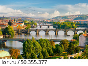 Row of bridges in Prague at summer day. Стоковое фото, агентство Ingram Publishing / Фотобанк Лори