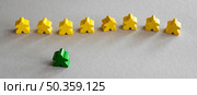 yellow green meeple board game pieces. Стоковое фото, агентство Ingram Publishing / Фотобанк Лори