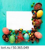sweets easter eggs near paper. Стоковое фото, агентство Ingram Publishing / Фотобанк Лори
