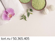 bath bombs herbal sea salt rolled up towels with orchid white backdrop. Стоковое фото, агентство Ingram Publishing / Фотобанк Лори