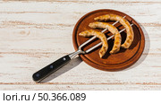 fork with roast sausages platter. Стоковое фото, агентство Ingram Publishing / Фотобанк Лори