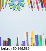multicolored writing implements with origami flower. Стоковое фото, агентство Ingram Publishing / Фотобанк Лори