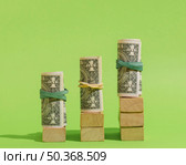 arrangement with banknotes wooden cubes. Стоковое фото, агентство Ingram Publishing / Фотобанк Лори