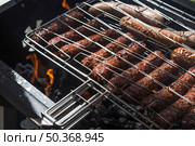 dark roasted sizzling sausages barbecue. Стоковое фото, агентство Ingram Publishing / Фотобанк Лори