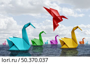 Changing your life concept and fearless courage symbol as diverse origami swans floating on water with a confident bird rising up and flying away as business confidence or fearlessness in a 3D illustration style. Стоковое фото, агентство Ingram Publishing / Фотобанк Лори