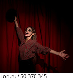 side view woman dressed as clown being happy. Стоковое фото, агентство Ingram Publishing / Фотобанк Лори