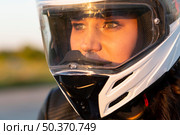 woman riding her motorcycle with helmet. Стоковое фото, агентство Ingram Publishing / Фотобанк Лори