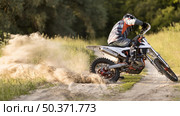 stylish man riding motorbike forrest. Resolution and high quality beautiful photo. stylish man riding motorbike forrest. High quality beautiful photo concept. Стоковое фото, агентство Ingram Publishing / Фотобанк Лори