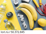 fitness items composed varicolored background. Стоковое фото, агентство Ingram Publishing / Фотобанк Лори