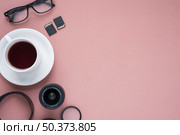cup tea camera lens spectacle memory cards extension rings colored pink. Стоковое фото, агентство Ingram Publishing / Фотобанк Лори
