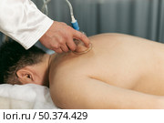 man suction cups session. Стоковое фото, агентство Ingram Publishing / Фотобанк Лори