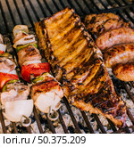well grilled meat pieces vegetables grill charcoal. Стоковое фото, агентство Ingram Publishing / Фотобанк Лори