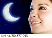 Portrait of a beautiful happy woman at night (moon created in PS) Стоковое фото, агентство Ingram Publishing / Фотобанк Лори