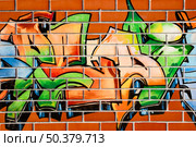 Brick-wall painted with grafitti - abstract background. Стоковое фото, агентство Ingram Publishing / Фотобанк Лори