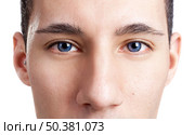 Close-up portrait of a young man with blue eyes - OBS: model use lens contact. Стоковое фото, агентство Ingram Publishing / Фотобанк Лори