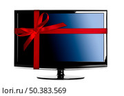Modern Led tv with a red Christmas ribbon. Стоковое фото, агентство Ingram Publishing / Фотобанк Лори