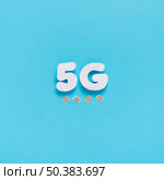 5g spelled out plain background with sim cards. Стоковое фото, агентство Ingram Publishing / Фотобанк Лори