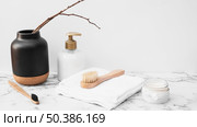brush towel moisturizing cream cosmetic bottle marble surface. Стоковое фото, агентство Ingram Publishing / Фотобанк Лори