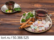 tea cup with turkish delight wooden table. Стоковое фото, агентство Ingram Publishing / Фотобанк Лори